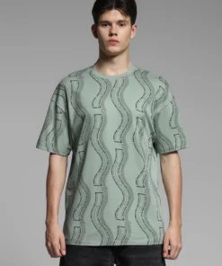 Trendy Green Oversized T Shirt Showcasing a Bold Print and Contemporary Casual Appeal